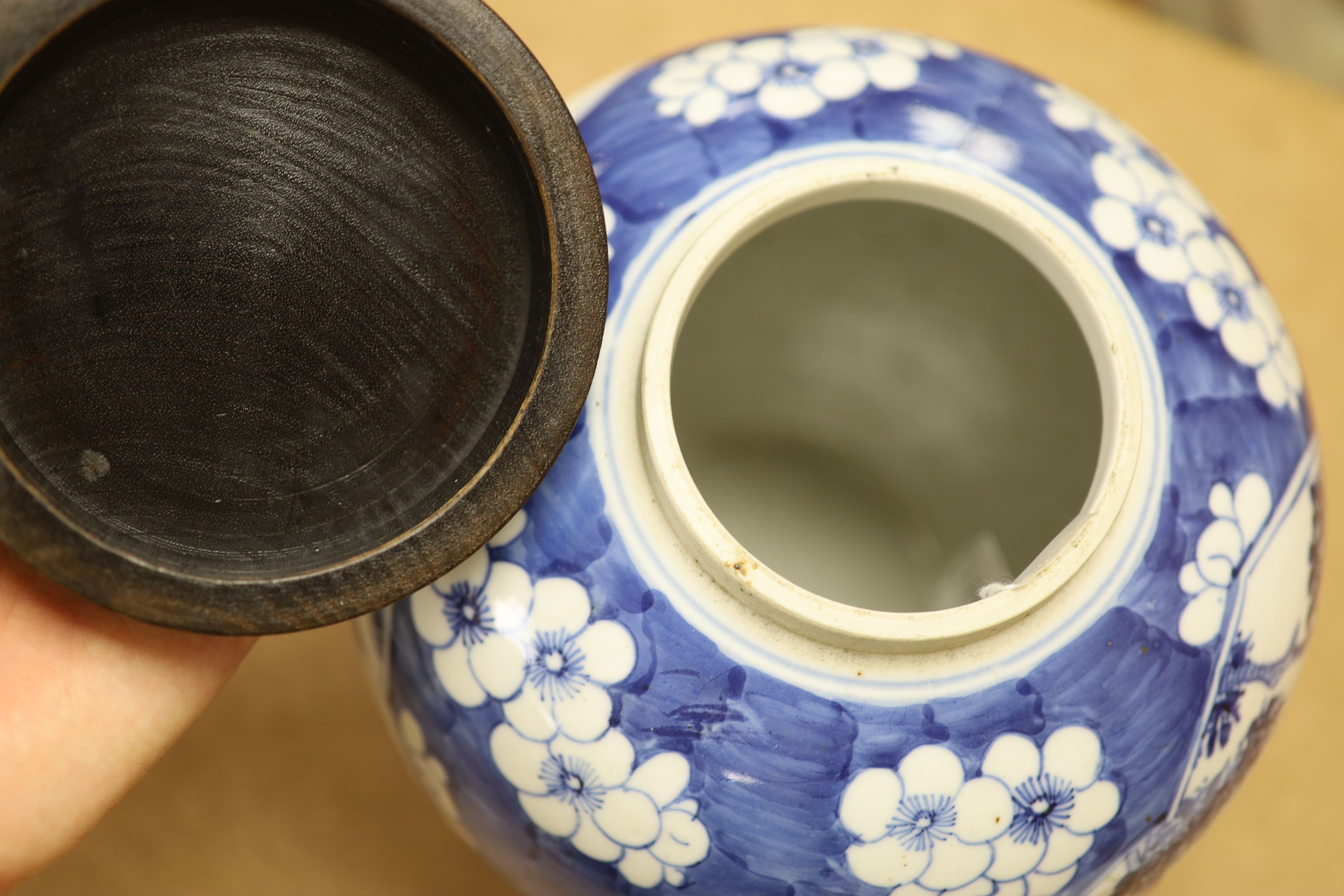 A late 19th / early 20th century Chinese blue and white jar, with wooden cover, height 25cm
